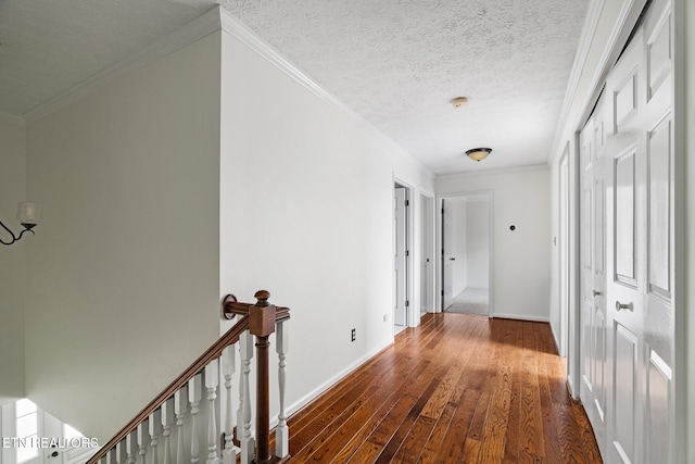 824 W Woodchase Rd, Knoxville, TN 37934 - hallway featuring an upstairs landing, dark wood-type flooring, ornamental molding, and a textured ceiling