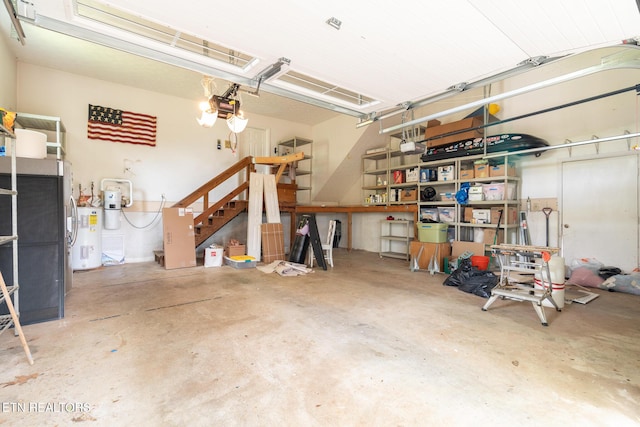 824 W Woodchase Rd, Knoxville, TN 37934 - garage with electric water heater and a garage door opener
