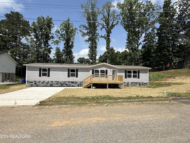 1684 Shields Dr, Morristown, TN 37814 - manufactured / mobile home featuring a wooden deck and concrete driveway