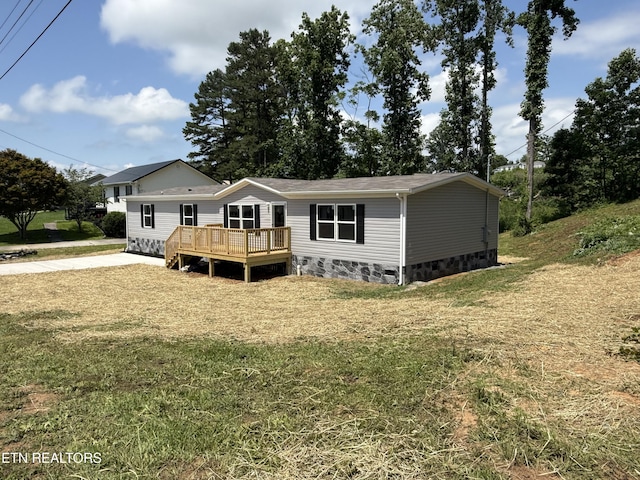 1684 Shields Dr, Morristown, TN 37814 - view of front facade with a wooden deck, a front lawn, and crawl space