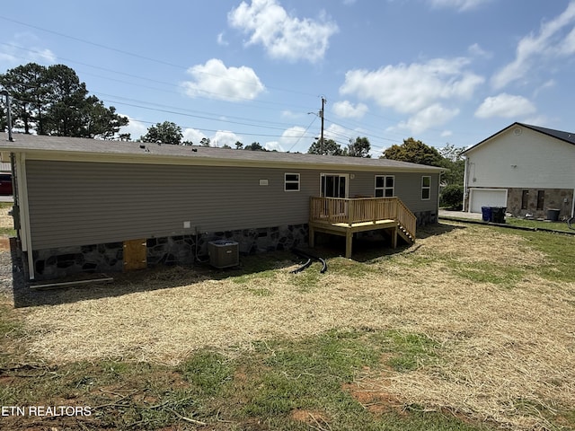 1684 Shields Dr, Morristown, TN 37814 - rear view of house featuring a wooden deck, a garage, and a yard