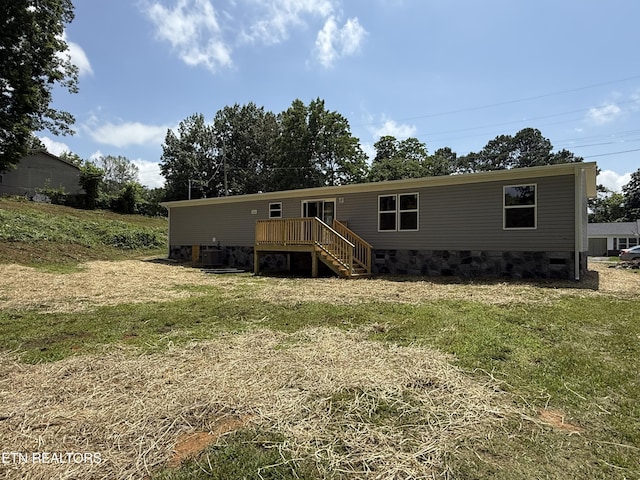 1684 Shields Dr, Morristown, TN 37814 - view of front facade with a wooden deck, a front yard, and stairs