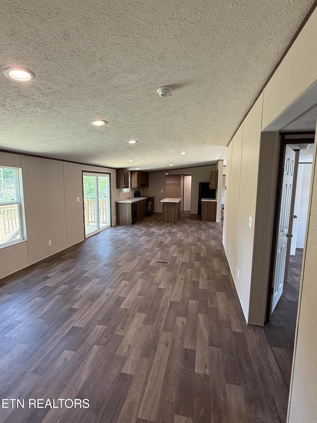 1684 Shields Dr, Morristown, TN 37814 - unfurnished living room with dark wood-style floors, a textured ceiling, and recessed lighting