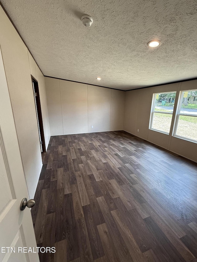 1684 Shields Dr, Morristown, TN 37814 - empty room with a textured ceiling, dark wood-style floors, and recessed lighting