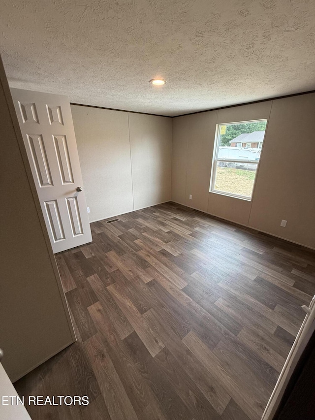 1684 Shields Dr, Morristown, TN 37814 - unfurnished room featuring dark wood-type flooring and a textured ceiling