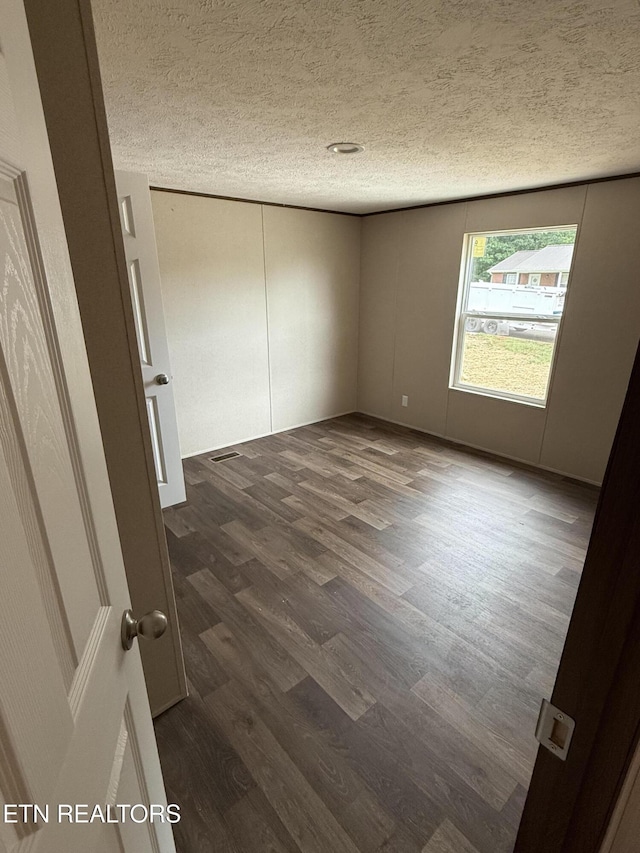 1684 Shields Dr, Morristown, TN 37814 - unfurnished room with a textured ceiling and dark wood-style floors