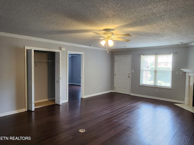 715 Cedar Ln Unit 135, Knoxville, TN 37912 - unfurnished living room with a ceiling fan, wood finished floors, crown molding, a fireplace with flush hearth, and a textured ceiling