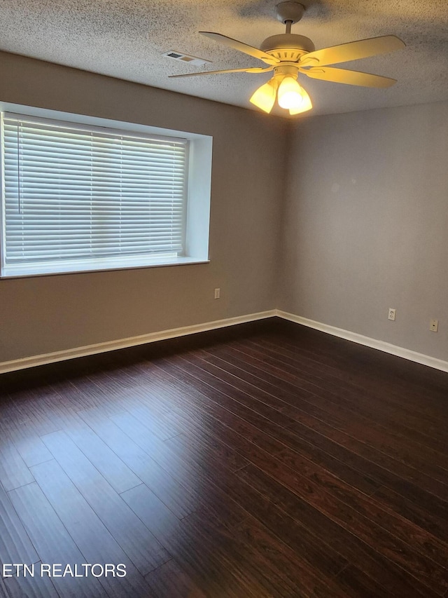 715 Cedar Ln Unit 135, Knoxville, TN 37912 - unfurnished room with dark wood-style floors, a ceiling fan, and a textured ceiling