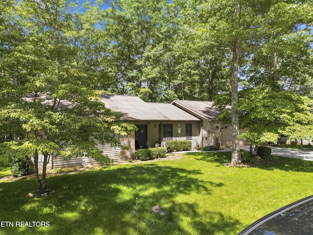 122 Glenwood Dr, Crossville, TN 38555 - view of front facade with a garage, a front yard, and concrete driveway