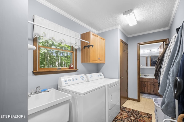 122 Glenwood Dr, Crossville, TN 38555 - washroom featuring cabinet space, independent washer and dryer, a textured ceiling, and ornamental molding