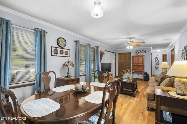 122 Glenwood Dr, Crossville, TN 38555 - dining area featuring ornamental molding, a textured ceiling, light wood finished floors, and ceiling fan