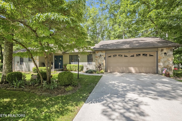 122 Glenwood Dr, Crossville, TN 38555 - ranch-style house with driveway, stone siding, a garage, a front lawn, and a shingled roof