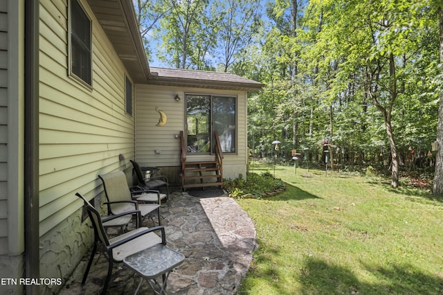 122 Glenwood Dr, Crossville, TN 38555 - view of grassy yard with a patio area and entry steps