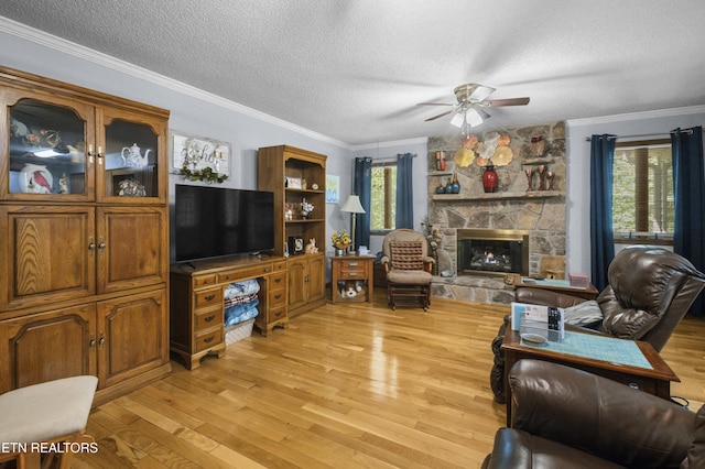 122 Glenwood Dr, Crossville, TN 38555 - living room with a textured ceiling, plenty of natural light, a ceiling fan, light wood finished floors, and ornamental molding