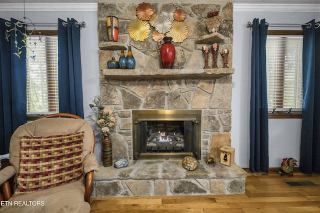 122 Glenwood Dr, Crossville, TN 38555 - detailed view of ornamental molding, a stone fireplace, and wood finished floors