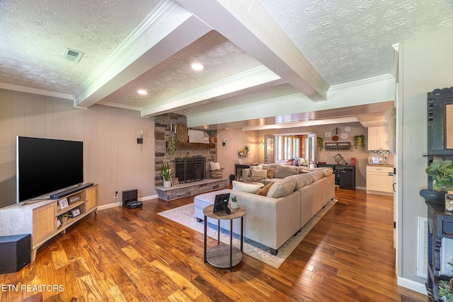 1839 Plumb Creek Cir, Knoxville, TN 37932 - living area with a textured ceiling, beamed ceiling, crown molding, wood finished floors, and a fireplace