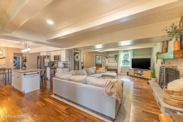 1839 Plumb Creek Cir, Knoxville, TN 37932 - living room featuring a textured ceiling, dark wood-type flooring, crown molding, a fireplace, and recessed lighting