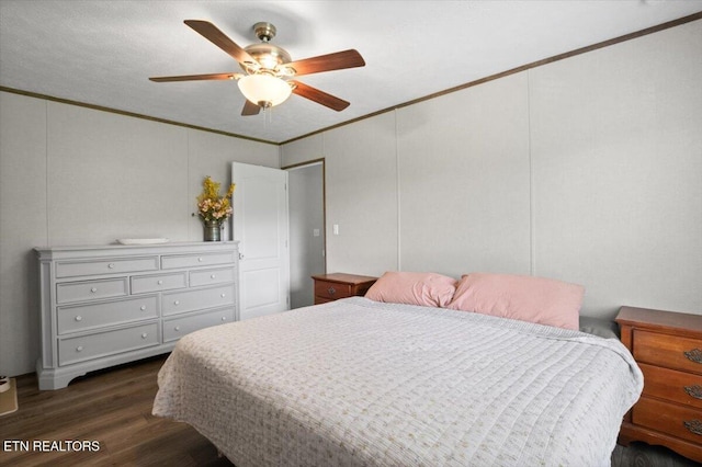 288 Forks Grove Rd, Lafollette, TN 37766 - bedroom featuring ornamental molding, dark wood-style floors, ceiling fan, and a decorative wall