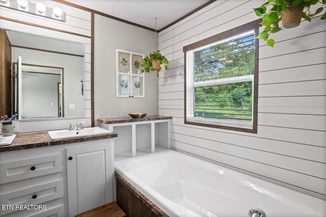 288 Forks Grove Rd, Lafollette, TN 37766 - bathroom with wooden walls, a garden tub, vanity, and crown molding