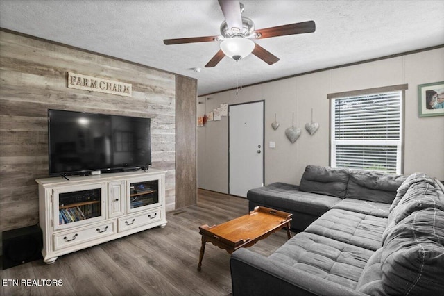 288 Forks Grove Rd, Lafollette, TN 37766 - living area with wood walls, ceiling fan, wood finished floors, and a textured ceiling