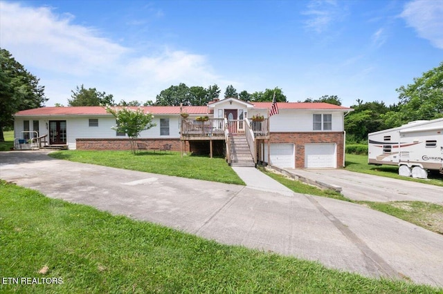 288 Forks Grove Rd, Lafollette, TN 37766 - ranch-style home featuring driveway, a garage, brick siding, stairs, and french doors
