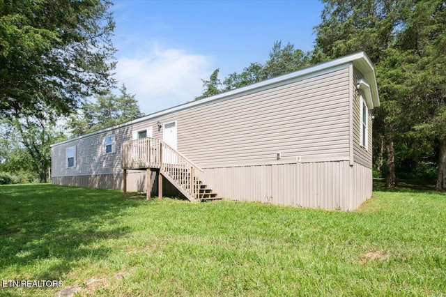 288 Forks Grove Rd, Lafollette, TN 37766 - rear view of property with a yard and stairway