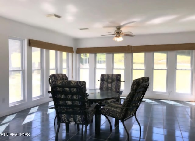 288 Forks Grove Rd, Lafollette, TN 37766 - dining room with dark tile patterned floors and a ceiling fan