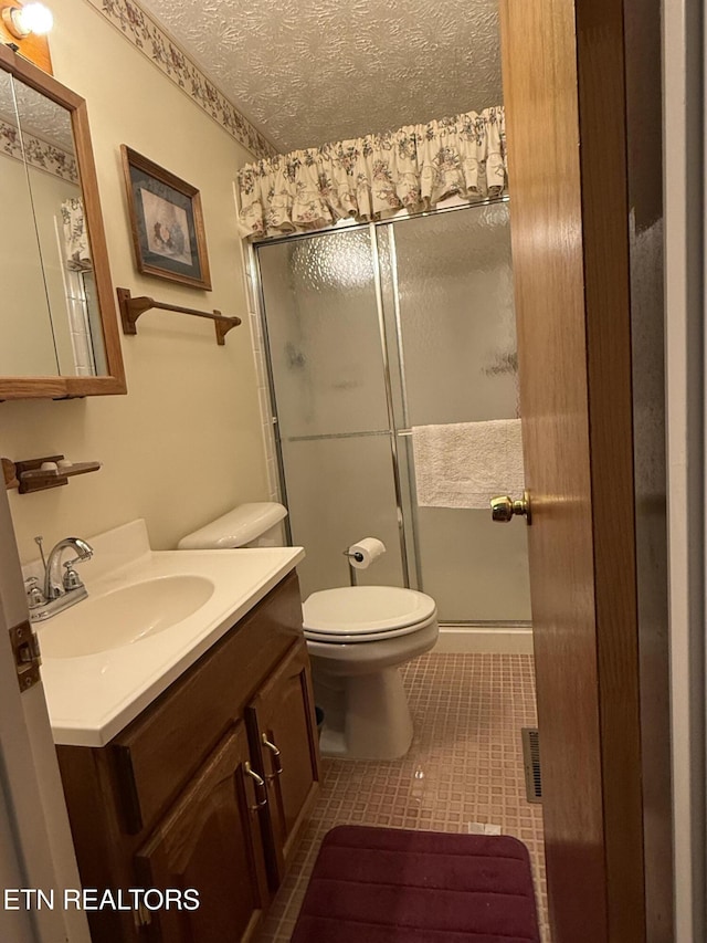 195 Hamblin St, New Tazewell, TN 37825 - full bath with vanity, a stall shower, tile patterned floors, and a textured ceiling