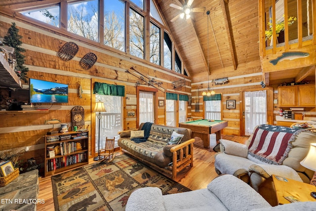 2784 Mountain View Cir, Sevierville, TN 37862 - living room with wood walls, high vaulted ceiling, a wooden ceiling with exposed beams, billiards table, and hardwood / wood-style floors