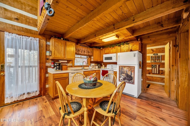 2784 Mountain View Cir, Sevierville, TN 37862 - kitchen with white appliances, a wooden ceiling with exposed beams, light wood-type flooring, light countertops, and brown cabinets