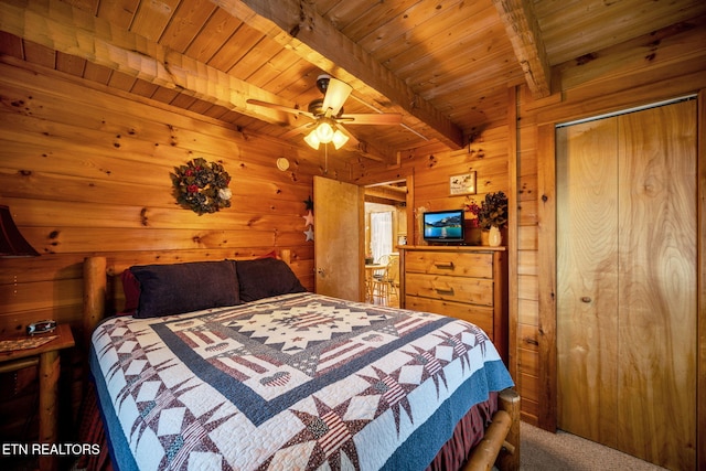 2784 Mountain View Cir, Sevierville, TN 37862 - bedroom with a wood ceiling with exposed beams, carpet, and wood walls