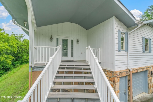 363 Staghorn Ln, Seymour, TN 37865 - doorway to property with stone siding, a yard, and a garage