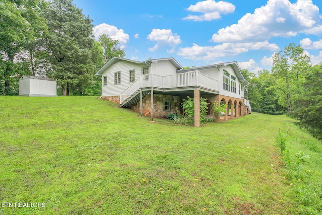 363 Staghorn Ln, Seymour, TN 37865 - back of house featuring a wooden deck, a lawn, a storage unit, and stairway