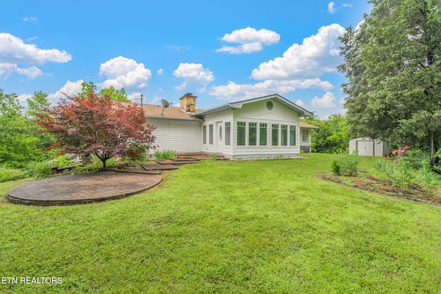 363 Staghorn Ln, Seymour, TN 37865 - rear view of house featuring a shed, a yard, and a chimney