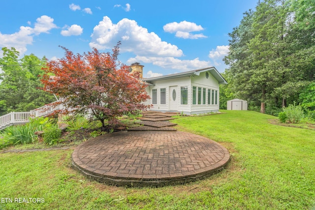 363 Staghorn Ln, Seymour, TN 37865 - rear view of property with a storage shed, a chimney, and a yard