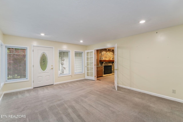 363 Staghorn Ln, Seymour, TN 37865 - entrance foyer with light carpet, a fireplace, and recessed lighting