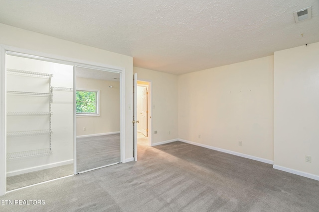 363 Staghorn Ln, Seymour, TN 37865 - unfurnished bedroom featuring carpet floors, a textured ceiling, and a closet