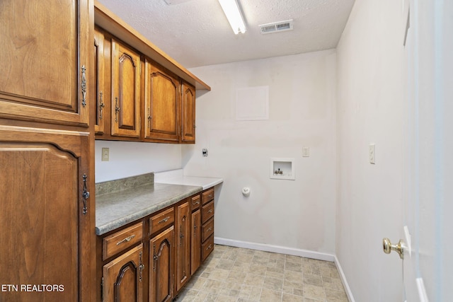 363 Staghorn Ln, Seymour, TN 37865 - washroom featuring cabinet space, a textured ceiling, washer hookup, and gas dryer hookup