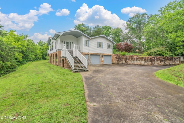 363 Staghorn Ln, Seymour, TN 37865 - view of front of property with stairs, driveway, a front lawn, and an attached garage