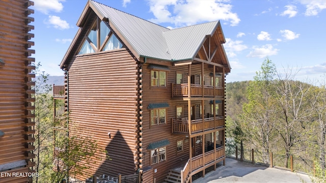 1032 Black Bear Cub Way, Sevierville, TN 37862 - view of side of property featuring log siding, a balcony, and a metal roof