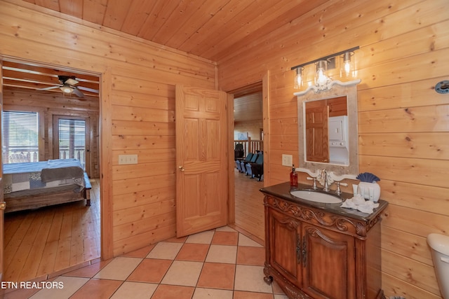 1032 Black Bear Cub Way, Sevierville, TN 37862 - half bathroom featuring ensuite bath, vanity, wooden walls, wooden ceiling, and ceiling fan