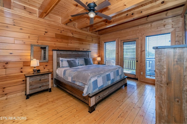 1032 Black Bear Cub Way, Sevierville, TN 37862 - bedroom with access to exterior, a wood ceiling with exposed beams, wood walls, light wood-type flooring, and a ceiling fan