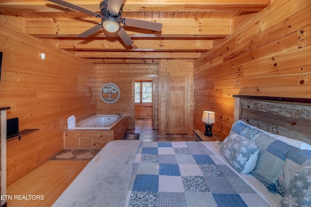 1032 Black Bear Cub Way, Sevierville, TN 37862 - bedroom featuring wooden walls and a wooden ceiling with exposed beams