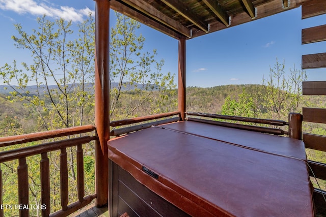 1032 Black Bear Cub Way, Sevierville, TN 37862 - wooden terrace with a hot tub and a view of trees