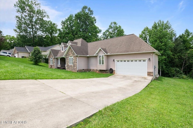 171 Forest Cove Ct, Jacksboro, TN 37757 - view of front of home with concrete driveway, an attached garage, stone siding, and a front lawn