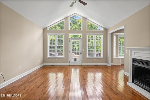 171 Forest Cove Ct, Jacksboro, TN 37757 - unfurnished living room with a fireplace, a ceiling fan, wood-type flooring, and vaulted ceiling