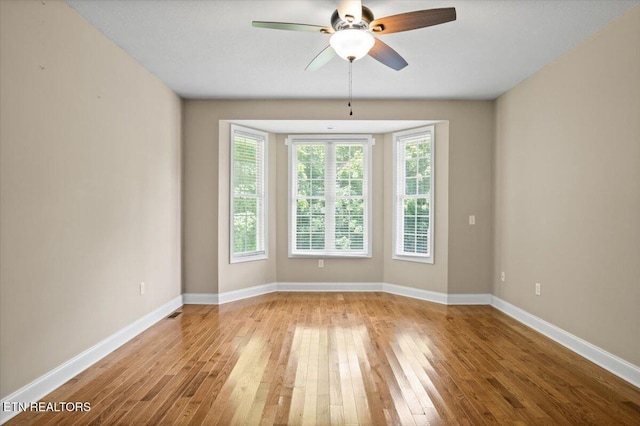 171 Forest Cove Ct, Jacksboro, TN 37757 - spare room featuring hardwood / wood-style flooring and a ceiling fan