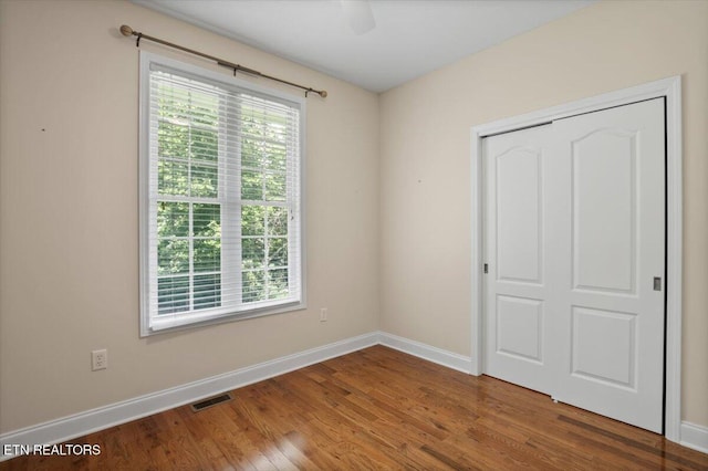 171 Forest Cove Ct, Jacksboro, TN 37757 - unfurnished bedroom with wood finished floors, a closet, and a ceiling fan