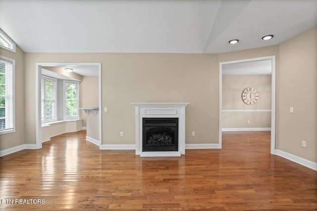 171 Forest Cove Ct, Jacksboro, TN 37757 - unfurnished living room featuring vaulted ceiling, wood finished floors, a fireplace, and recessed lighting
