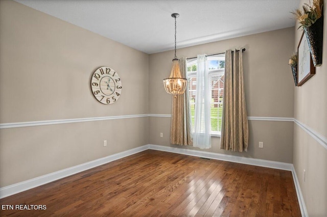 171 Forest Cove Ct, Jacksboro, TN 37757 - spare room featuring wood-type flooring and a chandelier